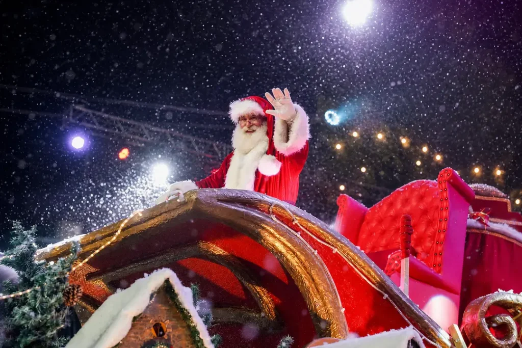 ¿Cuánto cuesta Natal Luz 2026/2027: entradas y gastos 2 Papai Noel no Grande Desfile de Natal do Natal Luz em Gramado, imagem editorial gerada por IA